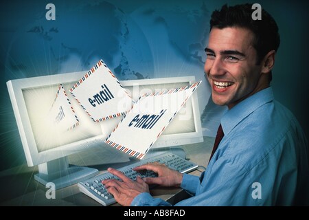 Man sending e-mails Stock Photo