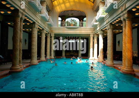 People bathing in the effervescent swimming pool of Gellert Thermal Baths or Gellert furdo located in Buda district in Budapest Hungary Stock Photo
