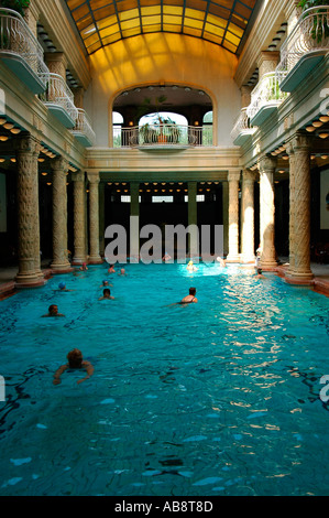 People bathing in the effervescent swimming pool of Gellert Thermal Baths or Gellert furdo located in Buda district in Budapest Hungary Stock Photo