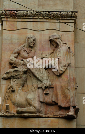 Frieze depicting a camel and an Arab merchant in Kiss utca Budapet Hungary Stock Photo