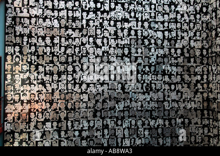 Installation of photos featuring victims of the Hungarian Communist regime displayed displayed House of Terror Haza Museum in Budapest Hungary Stock Photo