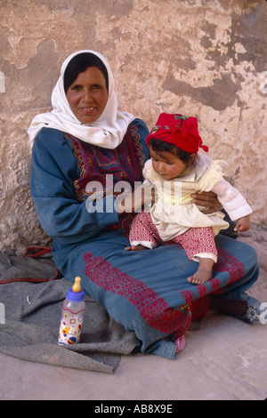 bedouin with little child in the lap, Jordan, Petra Stock Photo