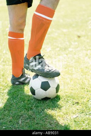 Footballer with football Stock Photo