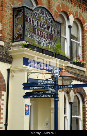 Exterior of Duke of Cumberland Hotel and signposts Whitstable Kent England Stock Photo