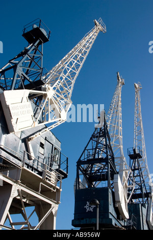 3 Cranes at Leith Docks, Edinburgh, Scotland against a clear blue sky Stock Photo