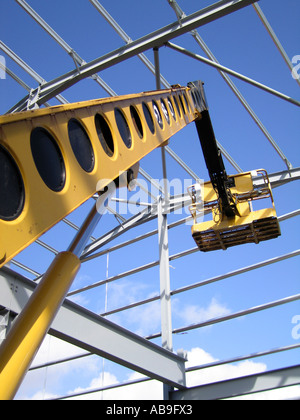 Steel portal frame building during construction with access hoist Stock Photo