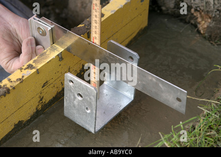 Measuring the distance for the pole holder in the concrete Stock Photo