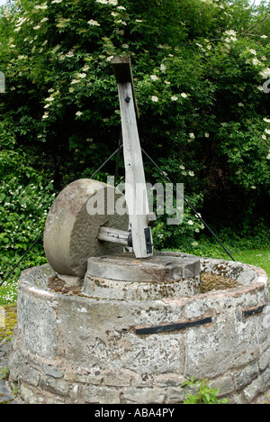 An old apple press in Hereford. These presses were used in the making of cider, it now is used as decoration. Stock Photo