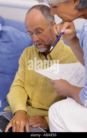 Couple working together Stock Photo