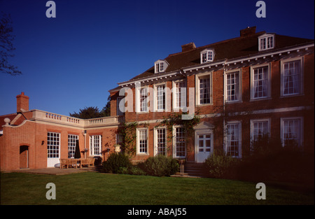 Queen Anne Style house with modern extension seen from garden in summer evening norfolk england britain uk gb europe eu Stock Photo