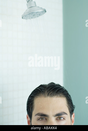 Man under shower, cropped Stock Photo