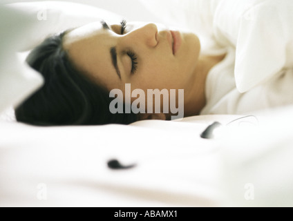 Young woman asleep in bed