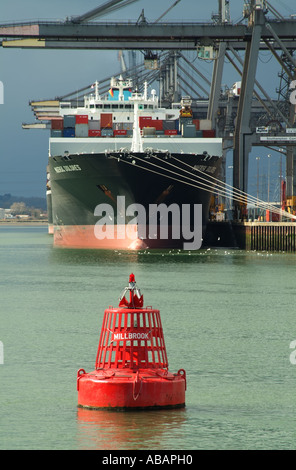 Southampton Container Terminal southern England. SCT straddle carrier unloading container ships Stock Photo