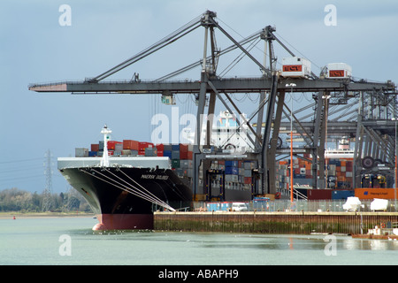 Southampton Container Terminal southern England. SCT straddle carrier unloading container ships Stock Photo