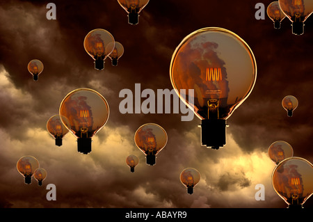 GLASS ELECTRIC LIGHT BULBS WITH GLOWING FILAMENTS CONTAINING IMAGE OF POWER STATION COOLING TOWERS FLOATING IN STORMY SKY Stock Photo