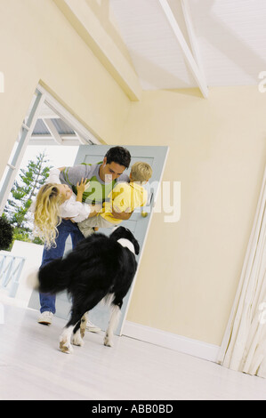 Father lifting children Stock Photo