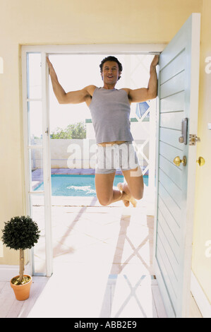 Man doing pull-ups Stock Photo