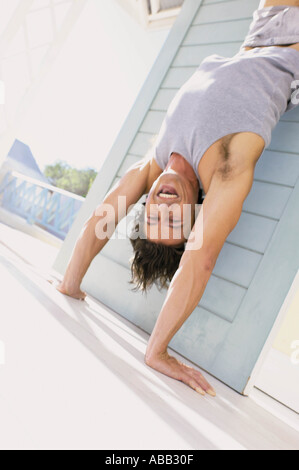 Man doing handstand Stock Photo