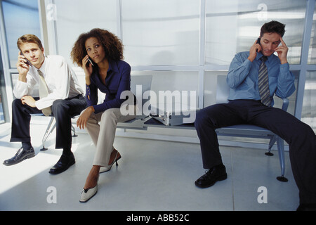 Businesspeople using their cellphones Stock Photo