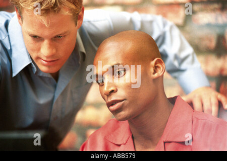 Businessmen working on computer Stock Photo