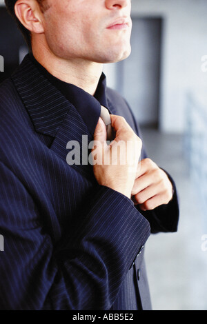 Man tying tie Stock Photo