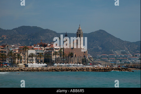 Platja de la Fragata, with Parish Church Esglesia Parroquial in background, Sitges Costa Daurada Catalunya Spain Europe Stock Photo