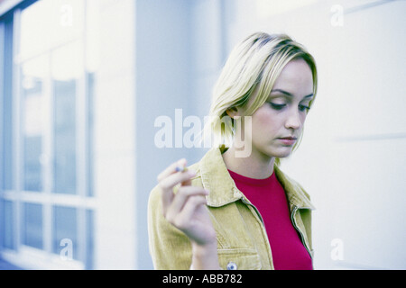 Woman smoking cigarette Stock Photo