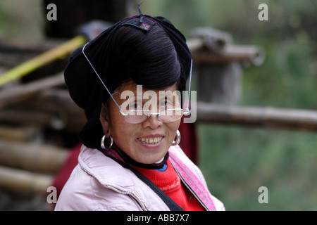 Yao Woman with Long Black Hair and Reading Glasses, Longsheng, Dazhai Village, Terraced Rice Fields Stock Photo
