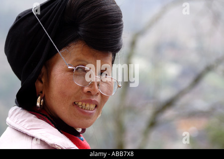 Yao Woman with Long Black Hair and Reading Glasses, Longsheng, Dazhai Village, Terraced Rice Fields Stock Photo