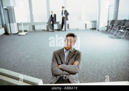 Businessmen in conference hall Stock Photo