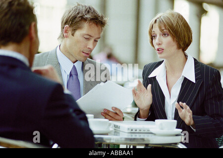 Businesspeople having meeting at cafe Stock Photo