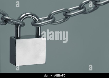 Metal Chain Secured with a Padlock Stock Photo