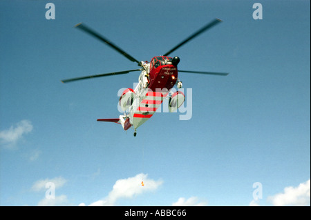 Coastguard Rescue Helicopter seen from below Stock Photo