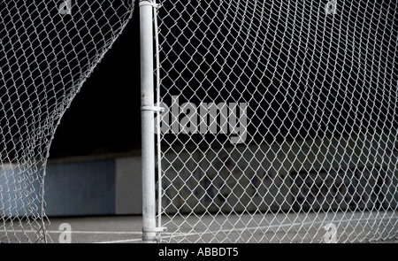 Broken chain linked fence Stock Photo