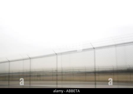 A section of chain linked fence securing perimeter Stock Photo
