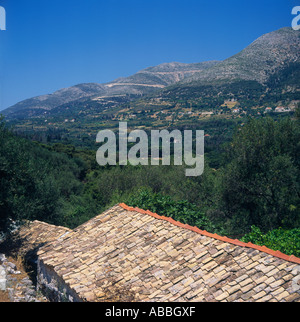 Northern landscape with Kalon-Oros Mountain in background seen over old tiled roof Cephalonia Island The Greek Islands Greece Stock Photo