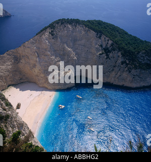 Classic white sand beach with high cliffs boats and deep blue sea at Wreck Beach Zakynthos Island The Greek Islands Greece Stock Photo