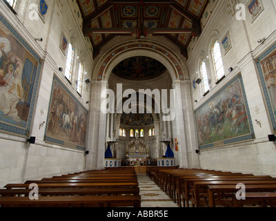 The basilica Basilique du Bois Chenu is devoted to Joan of Arc and inside large paintings depict her life story Near Domremy l Stock Photo