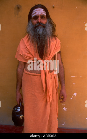 CMP70357 Indian Sadhu priest with beard wearing saffron clothes Stock Photo