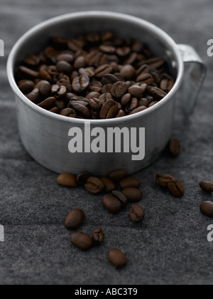 Roasted coffee beans on grey textile background Stock Photo - Alamy