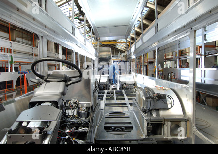Assembly worker at bus and coach manufacturing company East Stock Photo ...