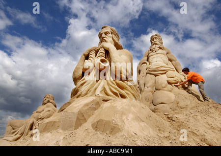 A sand sculptor creates a figure as part of a display based on the Roman Empire Stock Photo