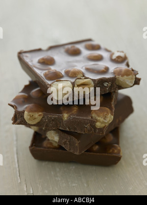 Stack of chunks of milk chocolate with nuts Stock Photo