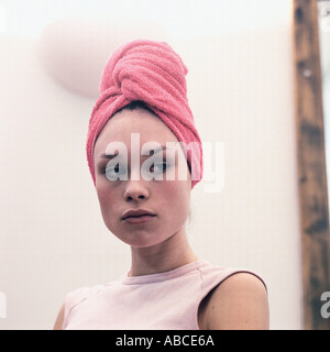 Woman with towel on head Stock Photo