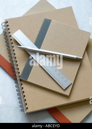 Notebooks pen and metal ruler Stock Photo