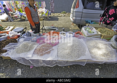 CHINA Beijing Wide variety of dried food rice shrimp and spices displayed for sale in open air roadside market Stock Photo