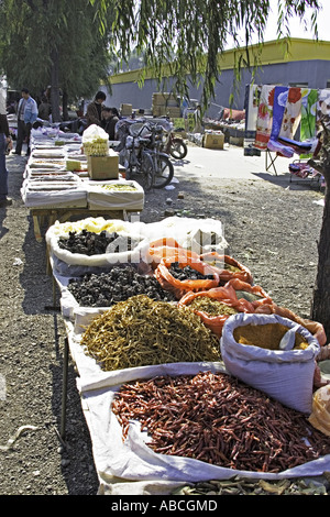 CHINA Beijing Wide variety of dried spices seasonings and condiments displayed for sale in open air roadside market Stock Photo