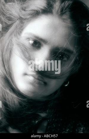 Young nude black woman portrait looking down in black and white Stock