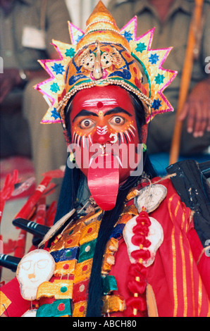 Young man north east Indian fancy dress as Goddess Kali Durga toung out role Stock Photo