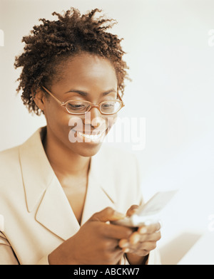 Woman sending a text message Stock Photo